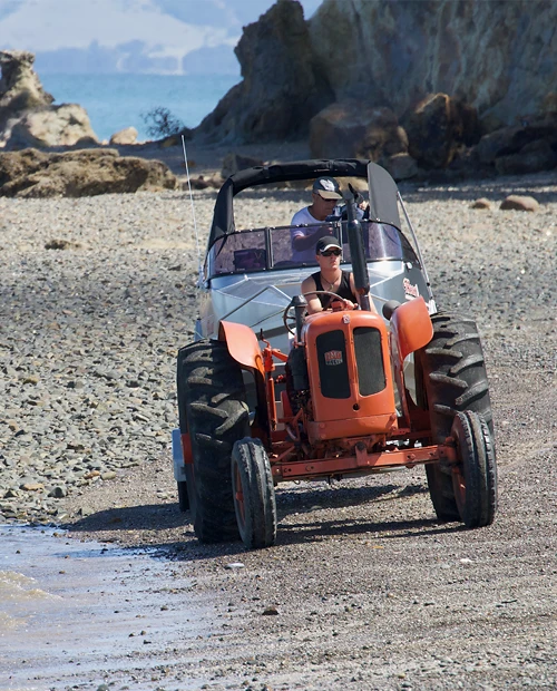 Tractor towing boat